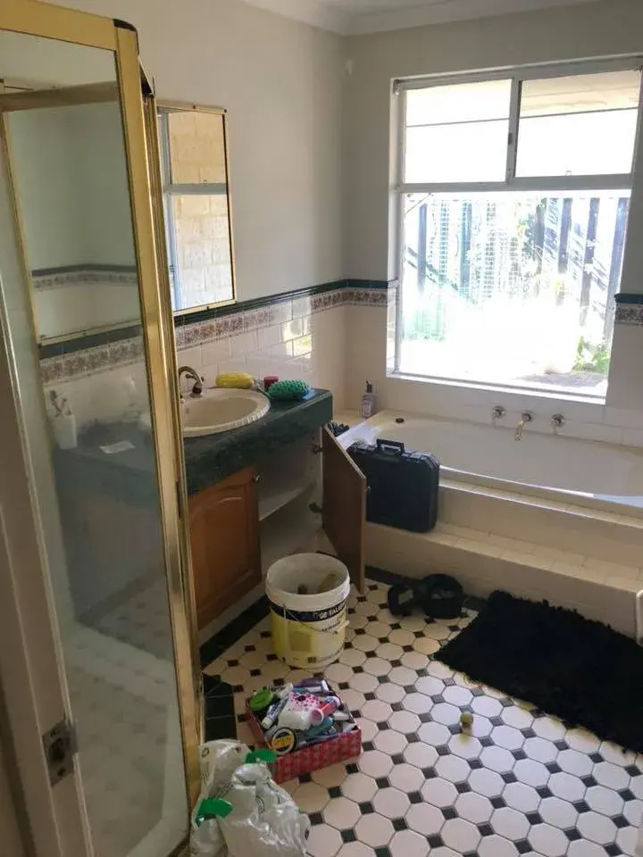 Dated bathroom with old wall and floor tiles before retiling